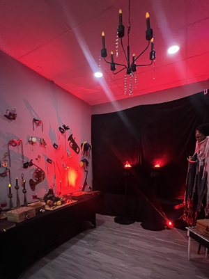 Masque of the Red Death Escape Room lit with red overtones