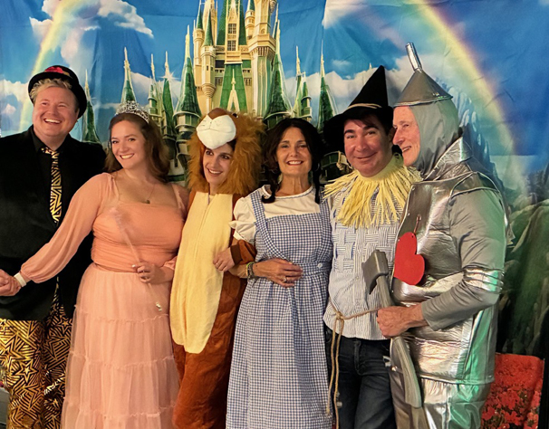 a group of 5 dressed in Wizard of Oz themed costumes